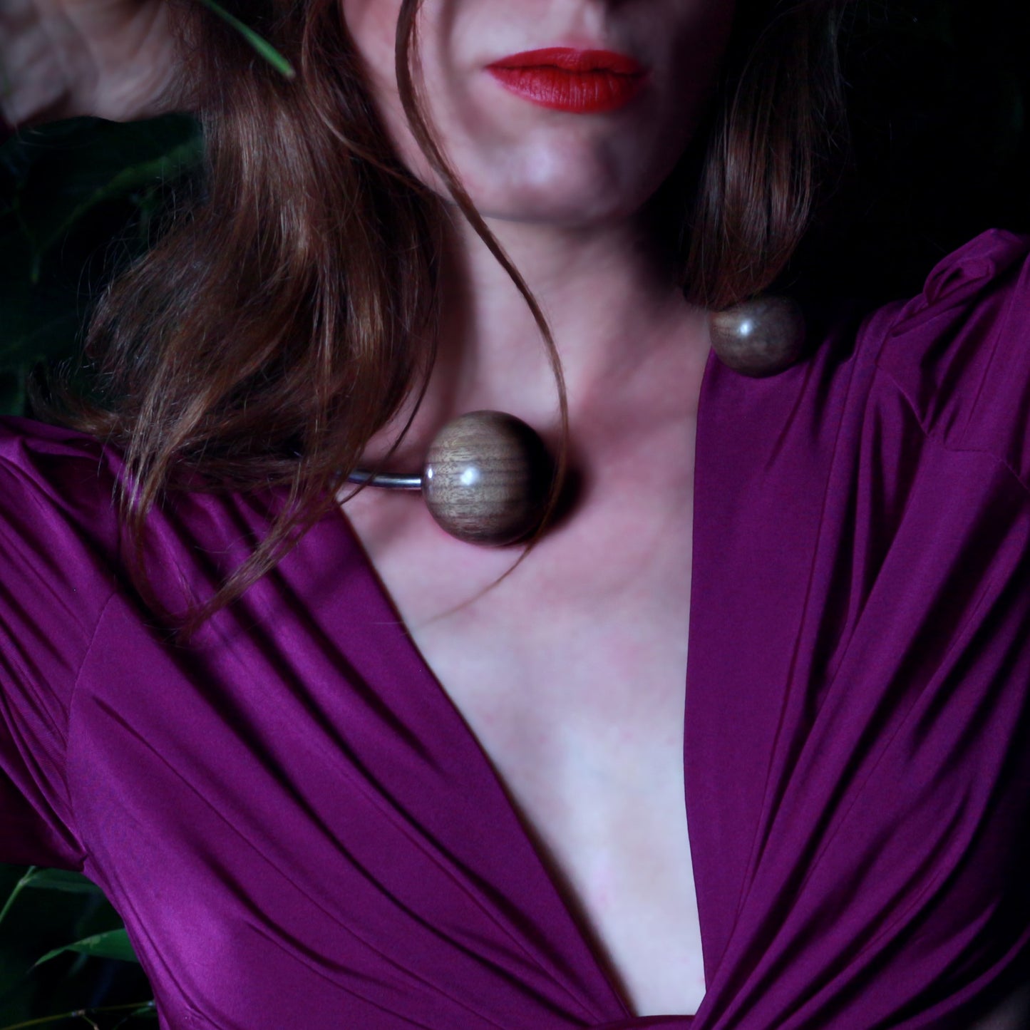 Model wearing the signature vegan Gaia Double Sphere Torque Necklace by Silverwood Jewellery