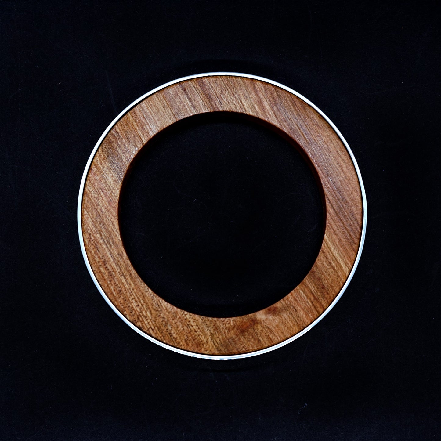 top view of the handmade red wood and sterling silver bangle by Silverwood Jewellery