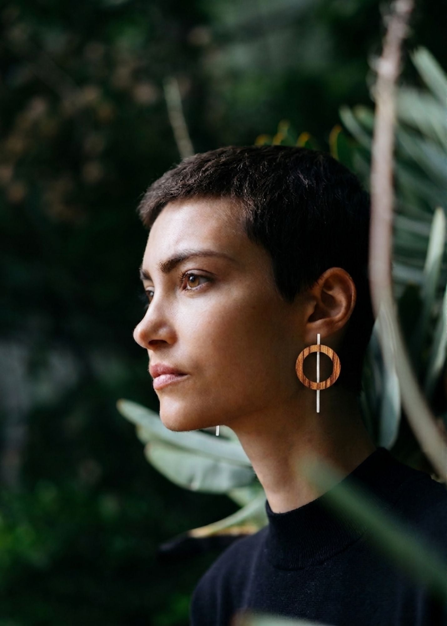 woman with short hair wearing silverwood wood and sterling silver earrings