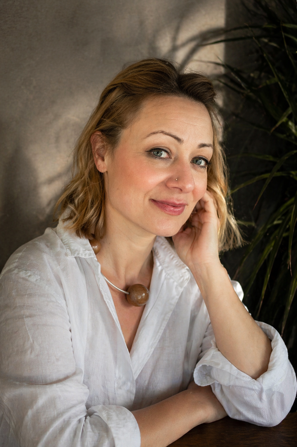 claire de bezenac designer and founder of silverwood in white shirt with necklace