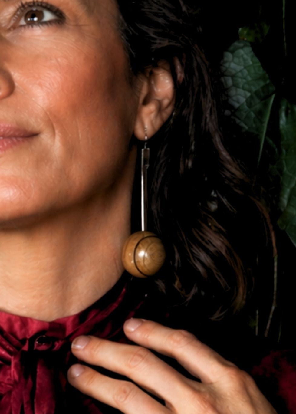 large drop earrings in silver and handturned woodon woman in satin shirt