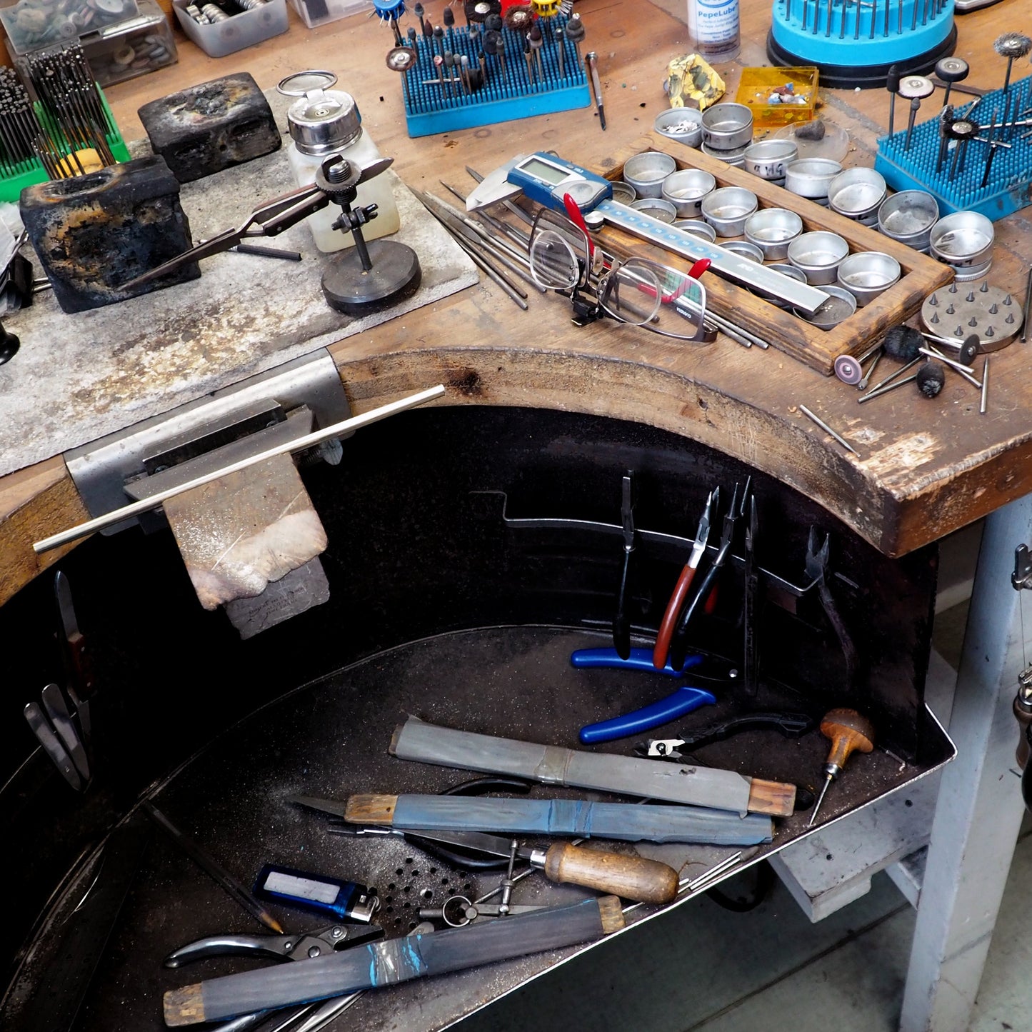view of jeweller's bench for handmaking silver and wood jewellery for silverwood