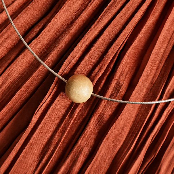 light wood bead on silver cable chain red back