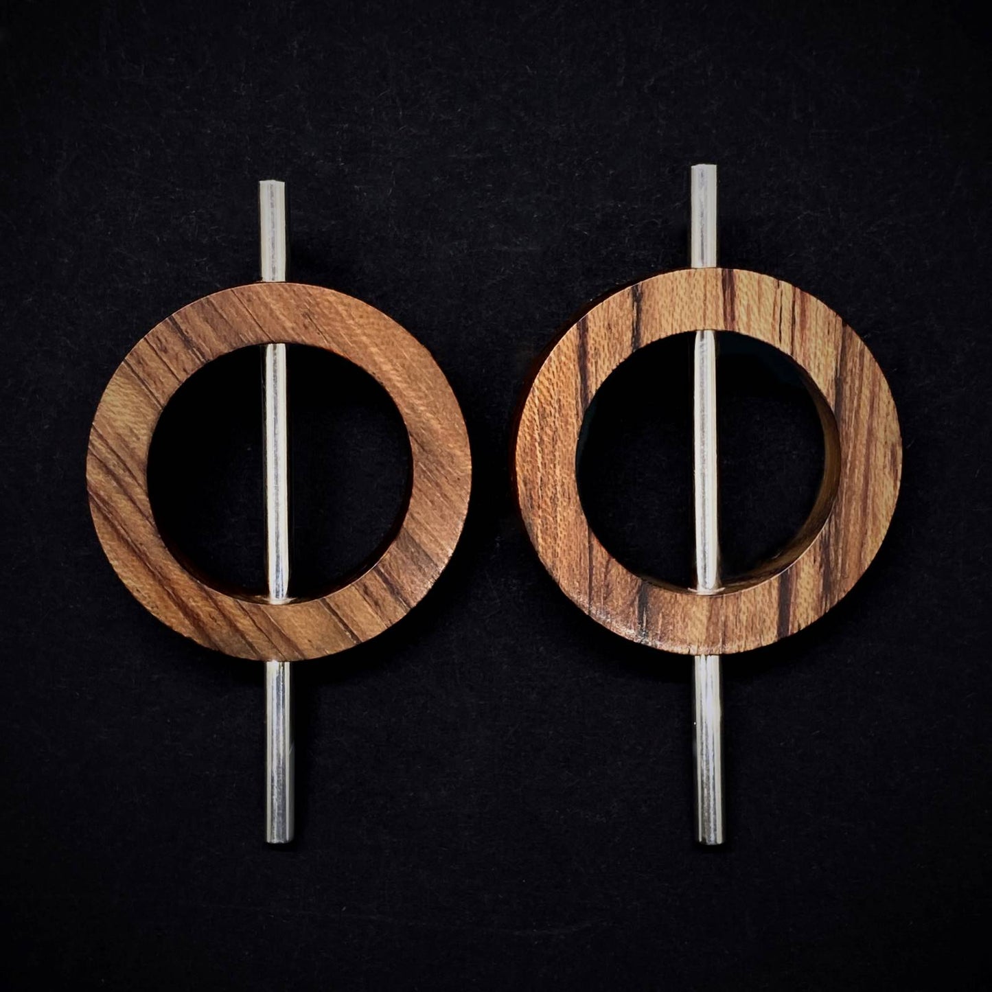 Load image into Gallery viewer, Statement earrings by Silverwood Jewellery with wood circles on sterling silver tube vegan jewelry
