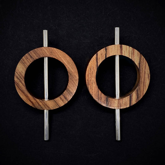 Statement earrings by Silverwood Jewellery with wood circles on sterling silver tube vegan jewelry