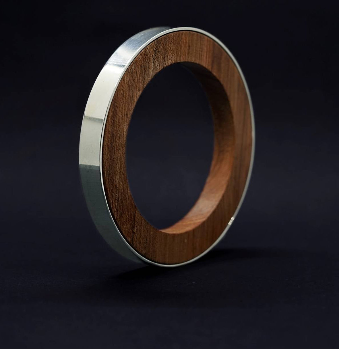 Iris Circle Bangle by Silverwood Jewellery with wood inner vegan polish and sterling silver bangle