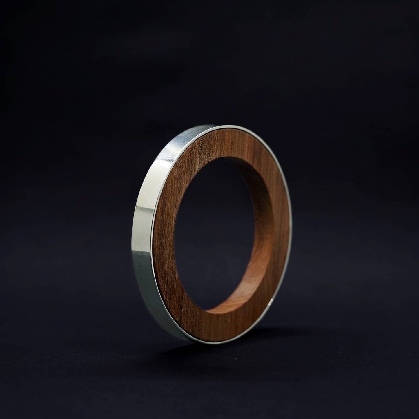 Iris Circle Bangle by Silverwood Jewellery with wood inner vegan polish and sterling silver bangle