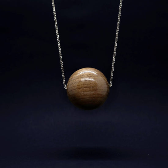 Giant vegan and wood bead pendant on sterling silver long chain by Silverwood Jewellery